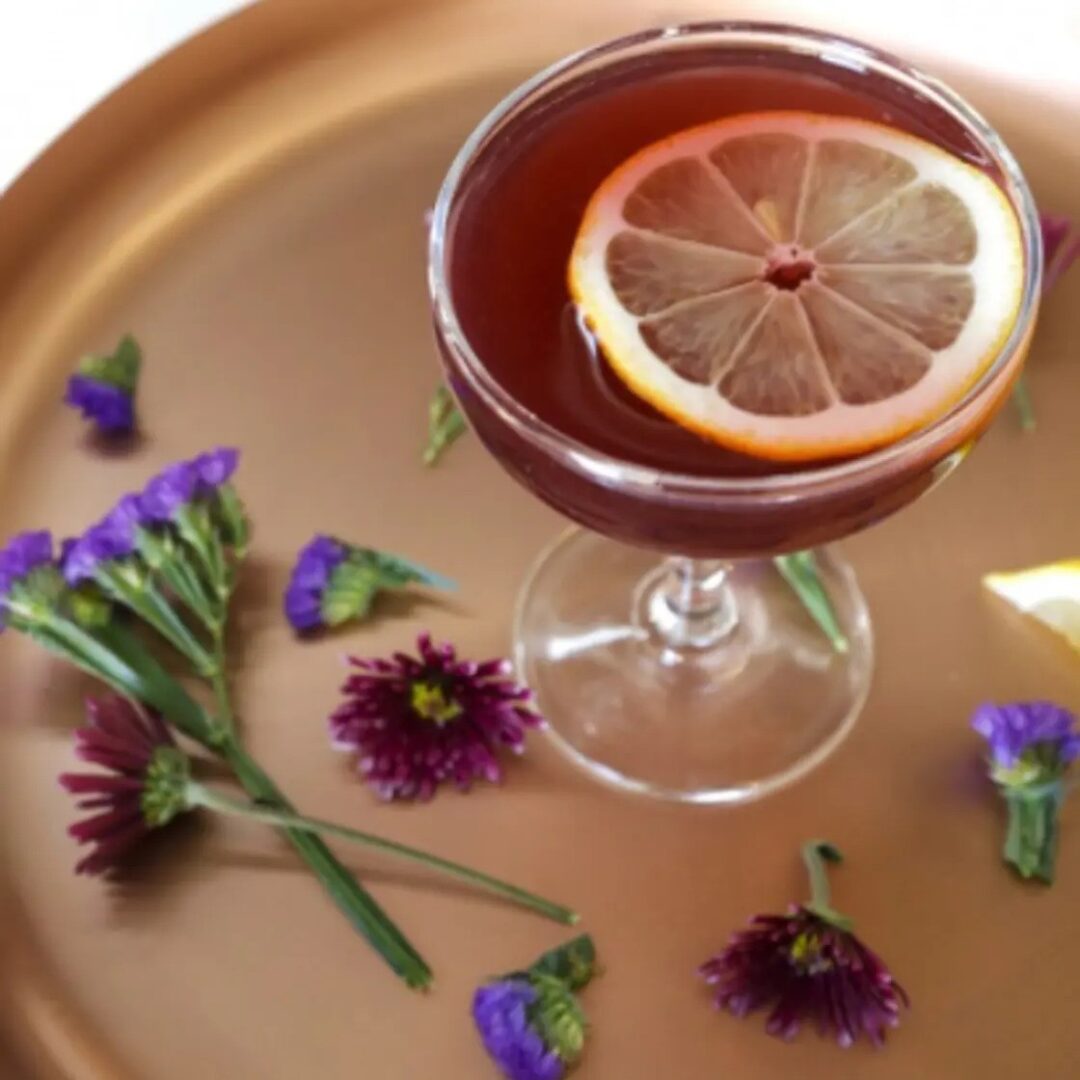 Elegant cocktail with lemon and flowers. Cocktails, Cocktail Servers, CocktailServers.com