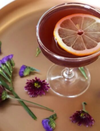 Elegant cocktail with lemon and flowers. Cocktails, Cocktail Servers, CocktailServers.com