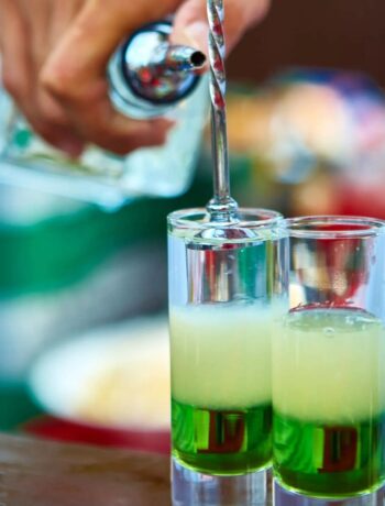 Mixing vibrant green cocktails for customers Cocktails Cocktail Servers CocktailSevers.com