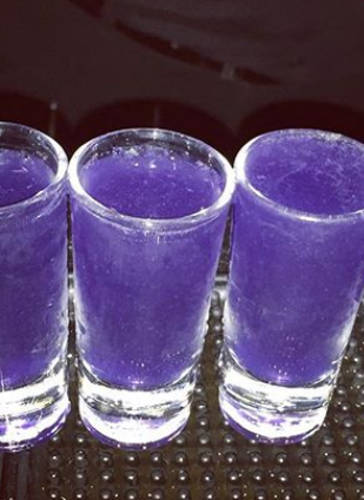 Purple shot glasses on a bar counter. Cocktails, Cocktail Servers, CocktailServers.com