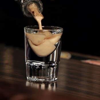 Pouring creamy cocktail into glass shot, Cocktails, Cocktail Servers, CocktailSevers.com