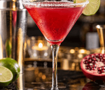 Pomapolitan cocktail recipe made with vodka, Cointreau, pomegranate juice, lime, 7-Up, and sweet and sour mix