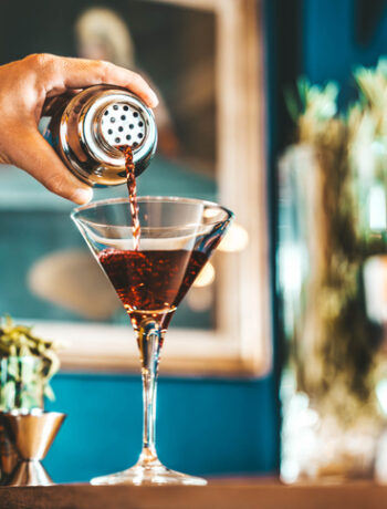 essential bar tools for home bartenders on a kitchen bar